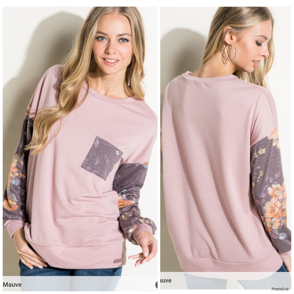 Dark mauve top with floral sleeves and pocket.